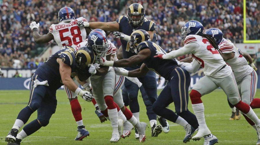 Landon Collins, pictured in the middle number 21, had a huge game against the Rams with two interceptions and a touchdown.