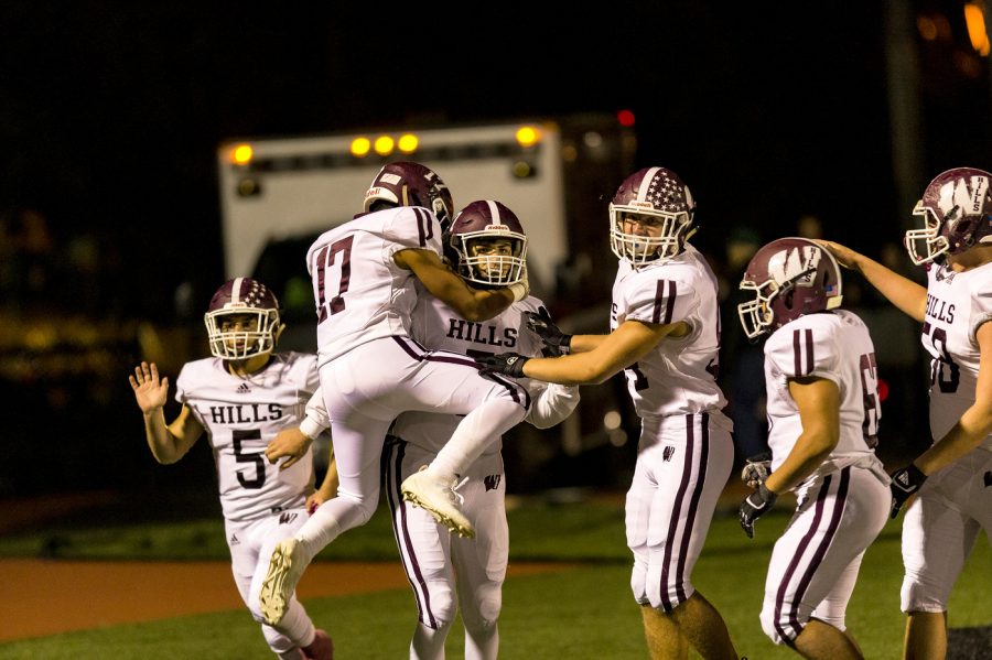 Wayne Hills players celebrate with quarterback Michael Casasanta after he ran for a long touchdown..