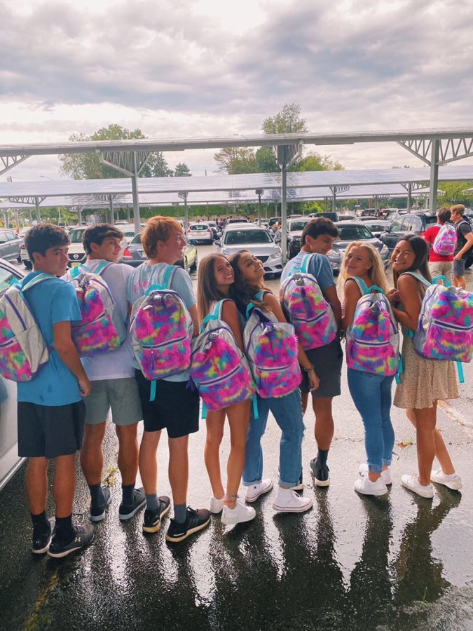 Seniors showing their stylish backpacks on the first day of school