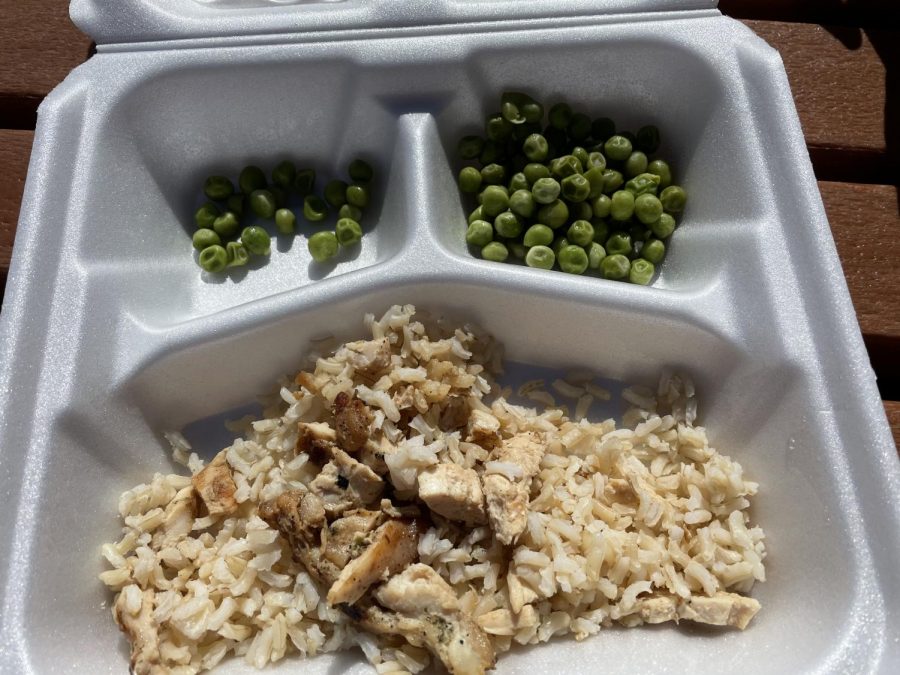 School lunch that is rice, chicken, and peas