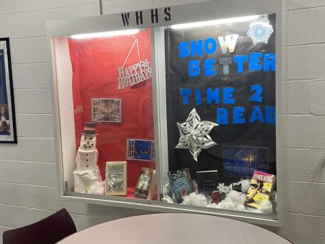 A holiday decoration display outside the Wayne Hills library, reading "Happy Holidays!" and depicting snowmen and snowflakes.