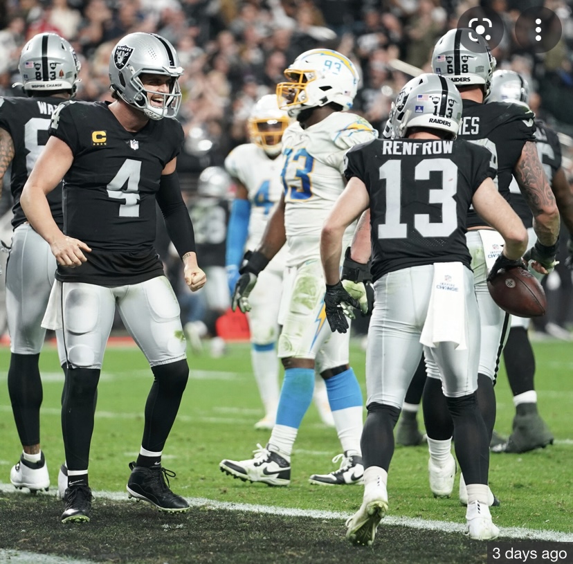 Raiders quarterback Derek Carr (left) and wideout Hunter Renfrow (right) celebrate after wild win over Chargers