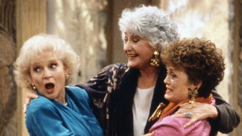 Three of the castmates hugging on The Golden Girls