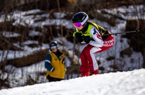 Wayne Hills skier going down the slopes at the state tournament