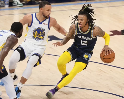 Ja Morant (12) facing off against Steph Curry (30) in Game 2 of their series