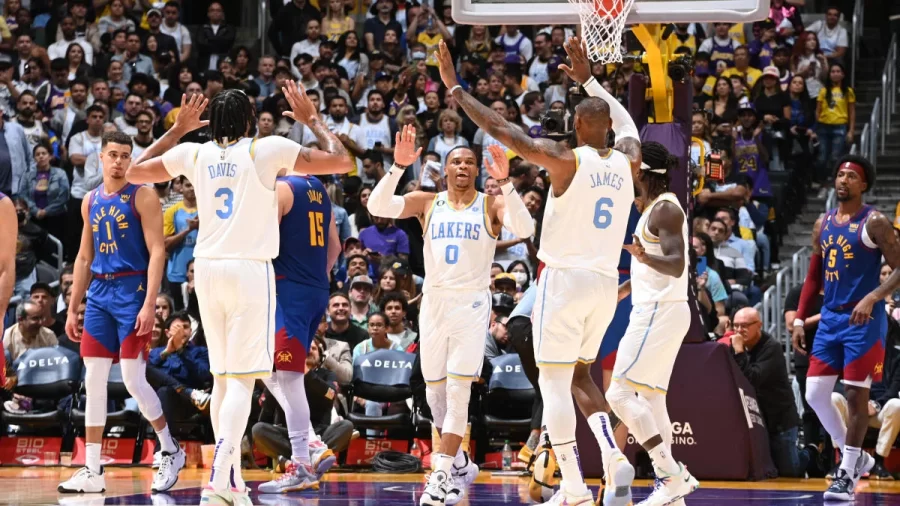 Lakers players Davis, James, Westbrook, and Beverly celebrating a score in their win against the Nuggets (CBS Sports)
