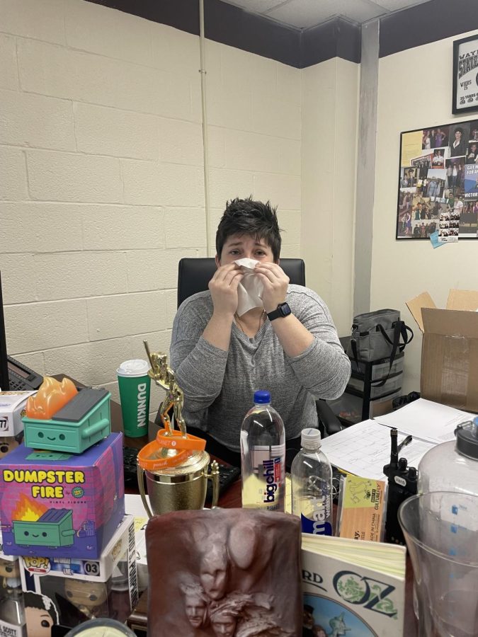 Mrs. Ventimiglia blowing a tissue.
