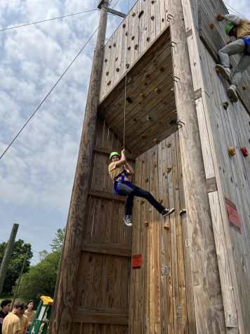 Sophomore Chloe Levy climbing a rock wall! 