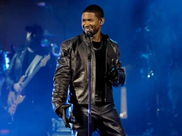 Famous singer and dancer Usher performing on stage 