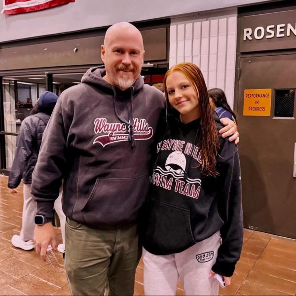 Parker Gentile and swim coach Mr. Shale celebrating her new record!