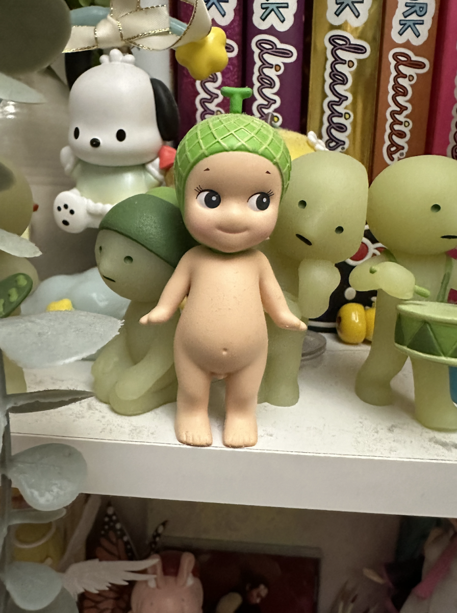 Jenna Huynh's Sonny Angel next to a Smiski Figure